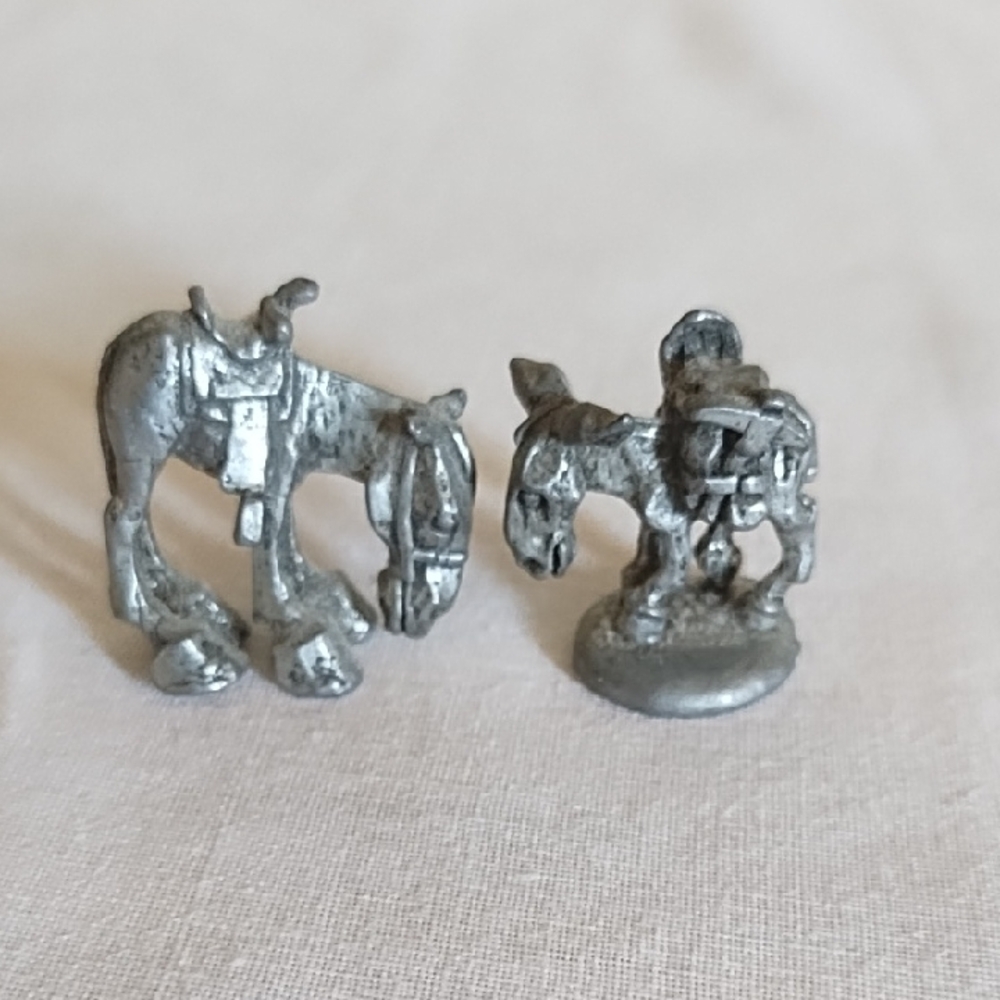 TWO VINTAGE PEWTER DONKEYS, OR MULES, ONE SAYS "BOYD" ON THE BOTTOM.